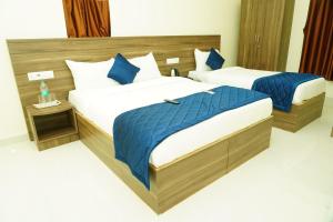Posteľ alebo postele v izbe v ubytovaní NJK Residency