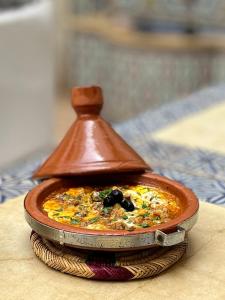 a small dish of food on a plate on a table at Riad des Lys in Marrakesh