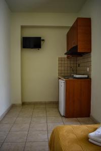 Кухня или кухненски бокс в Tsipos Rooms