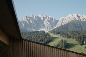 a view of a mountain range from a window at ATTO Apartments in San Candido +29 photos