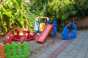 a group of childrens play equipment in a yard at Marcan Beach Hotel in Oludeniz