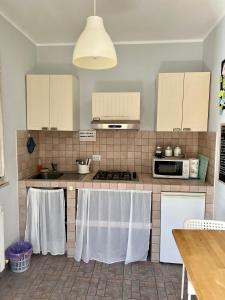 Kuchyň nebo kuchyňský kout v ubytování Casa Fè