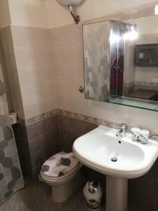 a bathroom with a sink and a toilet at Il Sogno in Foligno