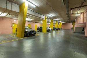 a large parking garage with cars parked in it at Lisbon Swimming pool apartment with private parking in Lisbon