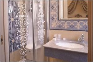 a bathroom with a sink and a shower at Hotel Aventino in Rome +31 photos