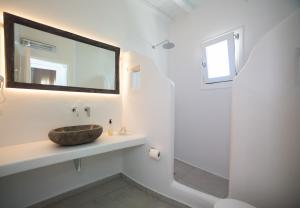 a bathroom with a sink and a mirror and a shower at Villa Meliti in Platis Gialos +106 photos