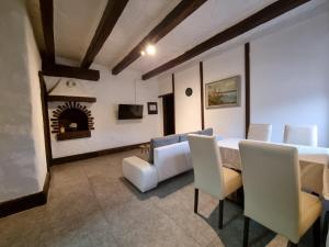 a dining room with a table and chairs and a fireplace at Apartment Rino in Rijeka