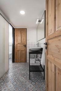 a bathroom with a sink and a mirror at Bouda u vleku in Pec pod Sněžkou