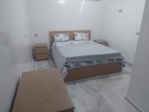 Łóżko lub łóżka w pokoju w obiekcie la résidence la siesta beach resort