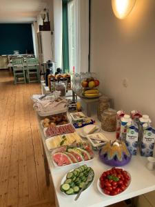 a buffet of food on a table in a room at Villa Karllösa Bed and Breakfast in Målilla