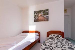 Postel nebo postele na pokoji v ubytování Studio apartmani Rafailovici