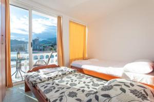 Postel nebo postele na pokoji v ubytování Studio apartmani Rafailovici