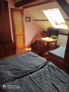 Posteľ alebo postele v izbe v ubytovaní Penzion u Lípy
