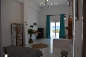 a bedroom with a bed and a view of the ocean at Maistrali in Provatas