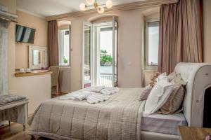 Postel nebo postele na pokoji v ubytování Oniro PargaTown Luxury Suites