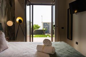 Postel nebo postele na pokoji v ubytování Ammare rooms