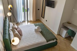 Postel nebo postele na pokoji v ubytování Ammare rooms