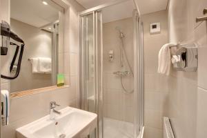 Kúpeľňa v ubytovaní MEININGER Hotel Salzburg City Center