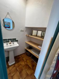a bathroom with a sink and a mirror at Charmant studio au calme terrasse privée place de parking sécurisée in Angers