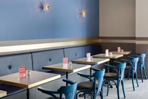 Reštaurácia alebo iné gastronomické zariadenie v ubytovaní MEININGER Hotel Salzburg City Center