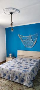 Una cama o camas en una habitación de Azzurro come il Mare