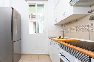 Kuchyňa alebo kuchynka v ubytovaní Livemálaga Gordon Home + 7 fotografií