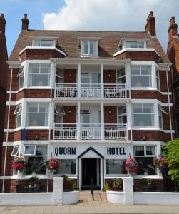 a large white building with two windows at The Quorn in Skegness