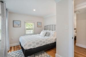 a bedroom with a bed and a window at The Wayfarer in South Haven