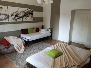 Postel nebo postele na pokoji v ubytování Levendula Apartman