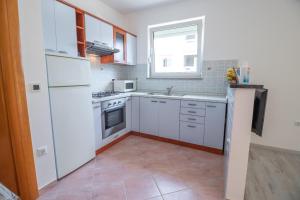 Kuchyňa alebo kuchynka v ubytovaní Apartments Gracia