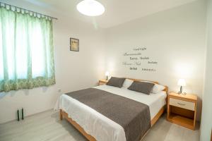 Posteľ alebo postele v izbe v ubytovaní Apartments Gracia