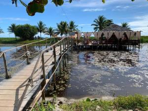 a resort with a dock in the water at Casa Sol in Prado