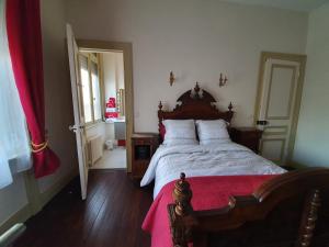 Кровать или кровати в номере B & B Les Secrets des Loges