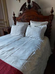 Кровать или кровати в номере B & B Les Secrets des Loges