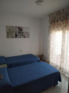 Posteľ alebo postele v izbe v ubytovaní PROALMAR, chalet 17