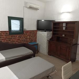 מיטה או מיטות בחדר ב-Le Casette casa vacanze