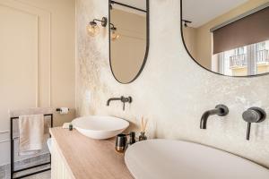 a bathroom with a sink and a mirror at Asboth Boutique Budapest in Budapest +19 photos