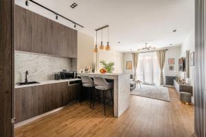 a kitchen with a counter and a bar in a room at Asboth Boutique Budapest in Budapest