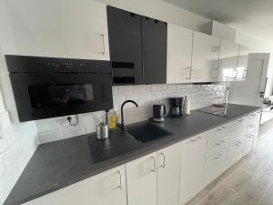 Kuchyň nebo kuchyňský kout v ubytování Apartament Na Wydmach Miedzywodzie