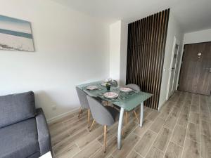 Posezení v ubytování Apartament Na Wydmach Miedzywodzie + 33 fotografií