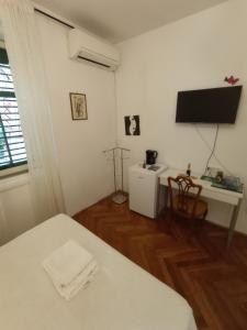 Posteľ alebo postele v izbe v ubytovaní Damjan Rooms