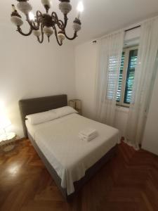 Posteľ alebo postele v izbe v ubytovaní Damjan Rooms