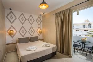 Postel nebo postele na pokoji v ubytování Atma Beach Rooms & Suites