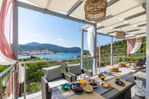 a villa with a view of the ocean at Ninemia Villa in Skopelos in Skopelos Town
