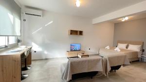 Posteľ alebo postele v izbe v ubytovaní Antheon Studio
