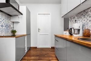 Kuchyň nebo kuchyňský kout v ubytování Apartament Revel