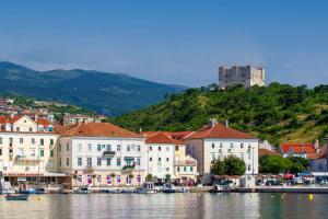 a group of buildings next to a body of water at Bonaca in Senj