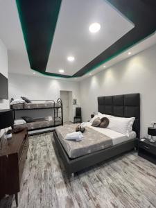 a bedroom with two bunk beds and a desk at Dream & Fly in Naples