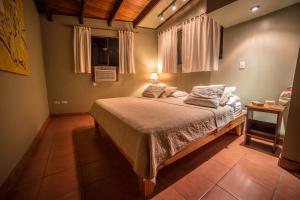 Postel nebo postele na pokoji v ubytování Villas Oasis