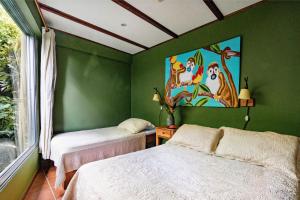 Postel nebo postele na pokoji v ubytování Villas Oasis